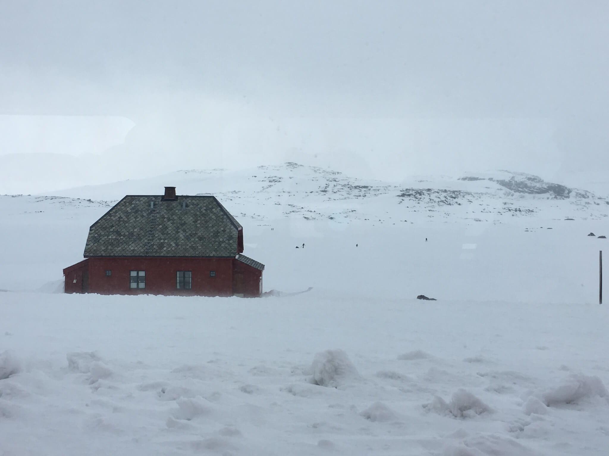 beautiful red barn in norway snow