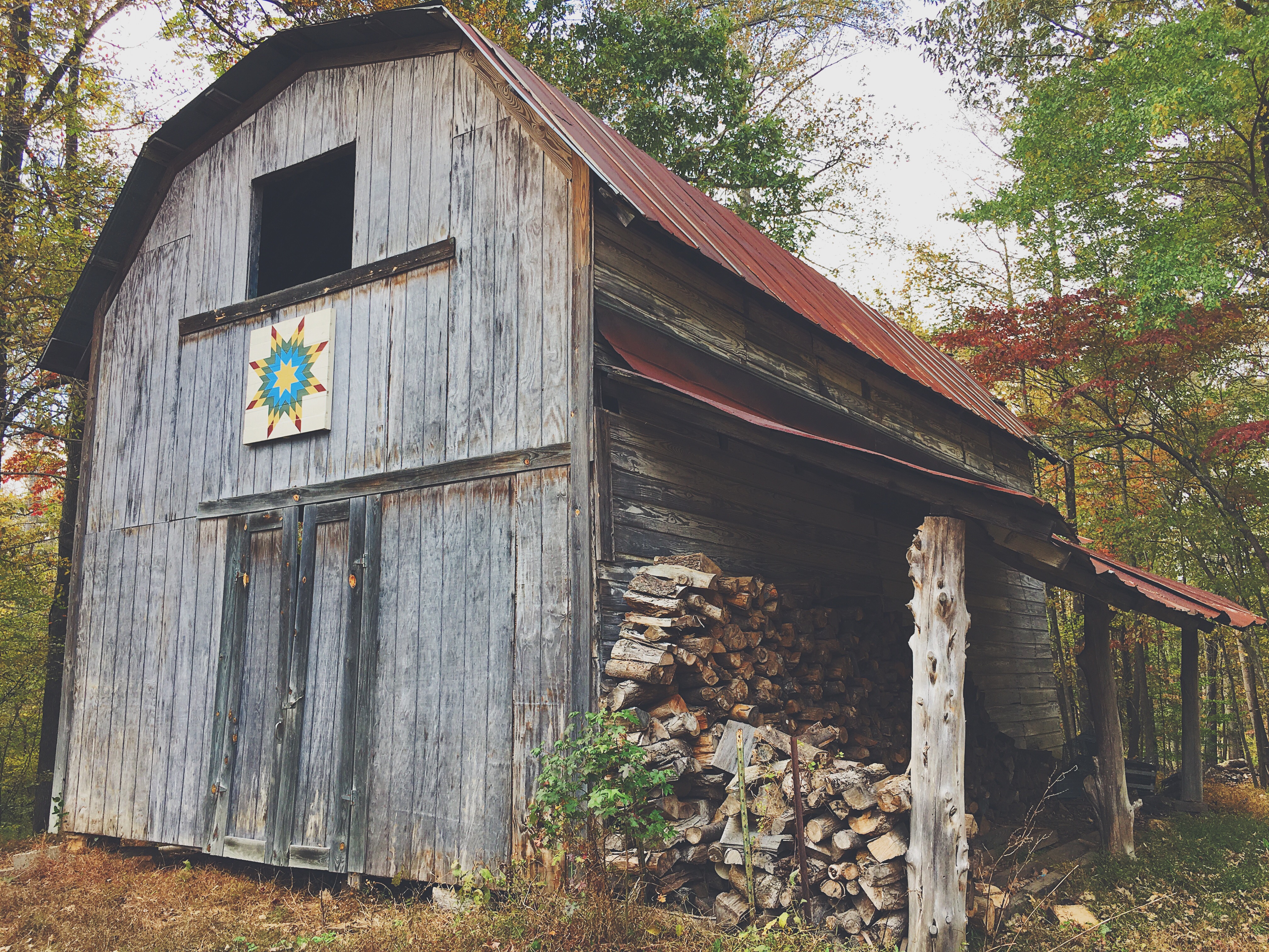 firewood under rustic barn