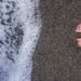 Black sand beach of Naples, Italy