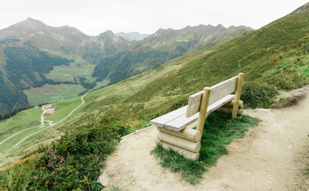 A bench to stop and gaze over the valley in Alpbach Austria
