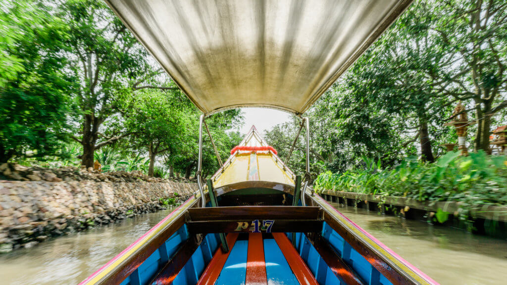Taking a ride on a speedboat to the Damnoen Saduak Floating Market