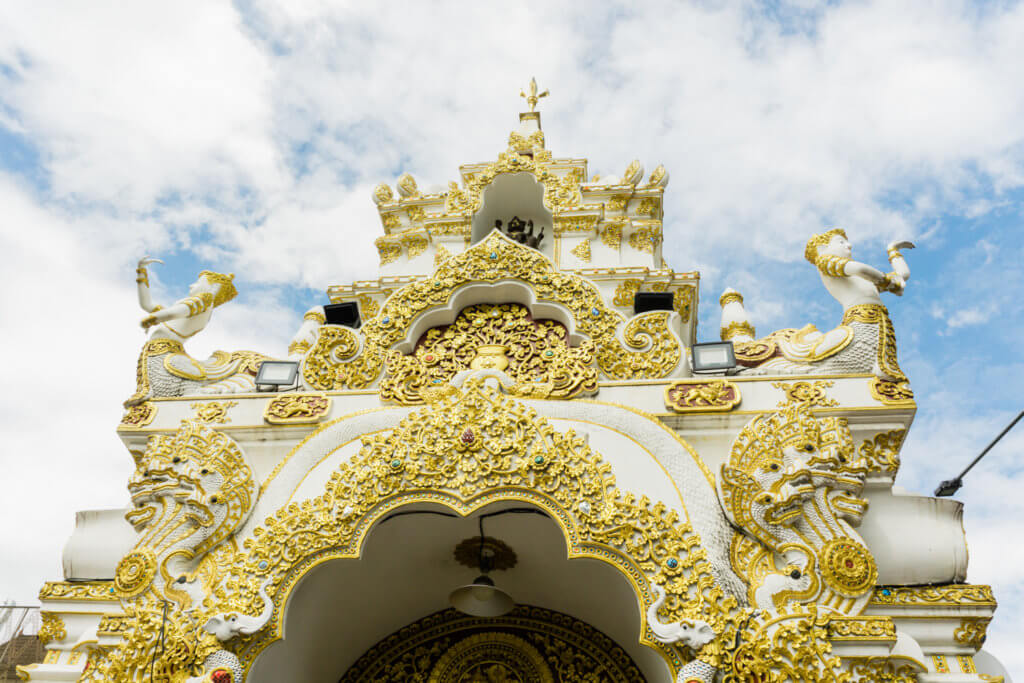 gold embellishes on pagodas in chiang mai