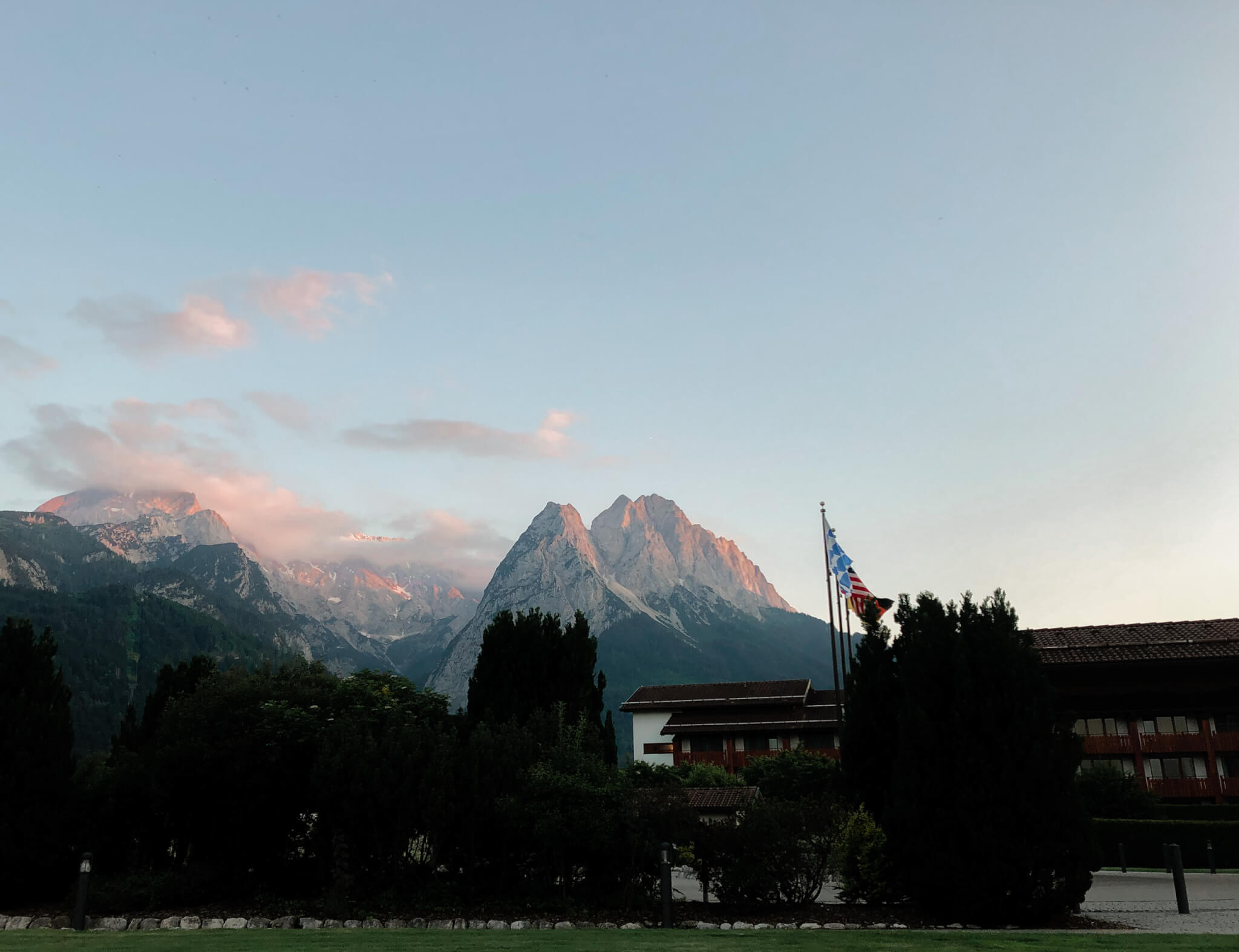 sun setting on the peaks of alpspitze and zugspitze in garmisch partenkirchen germany