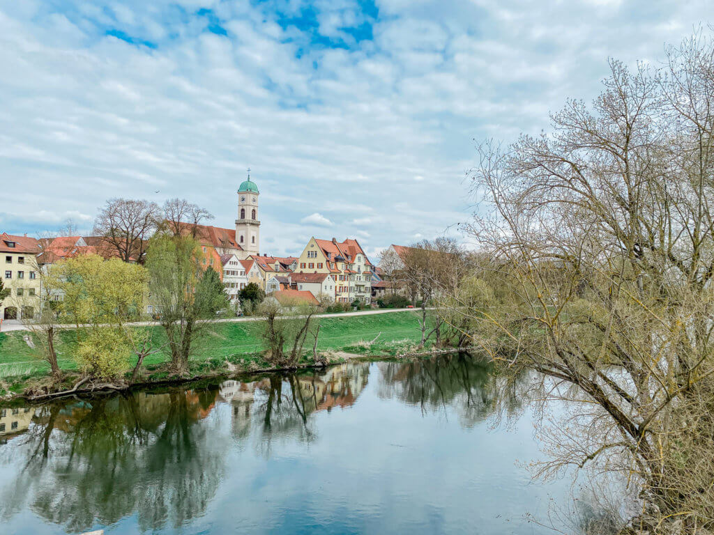 view of danube from old stone bridge in regensburg